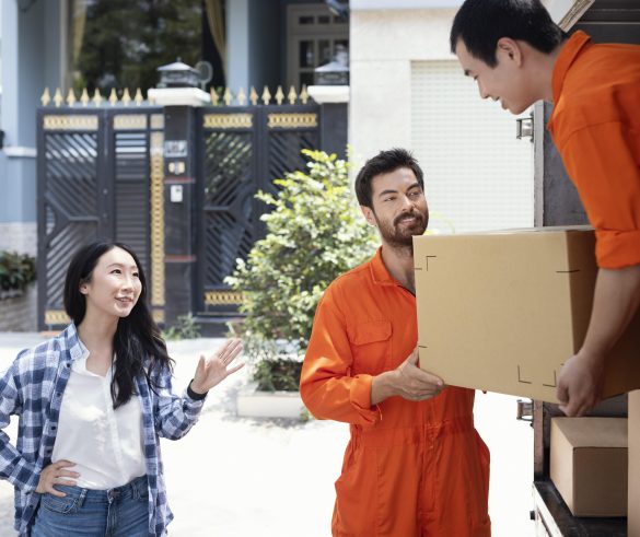 delivery-men-unloading-box-customer